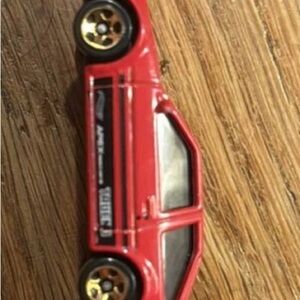 Speedy Red Toy Car with Gold Accents